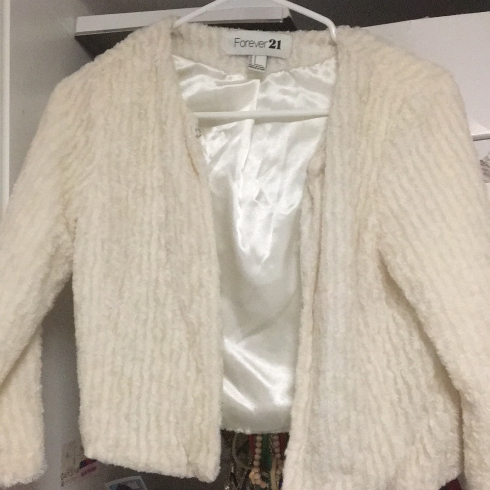 Mini faux fur cardigan with glitter accents